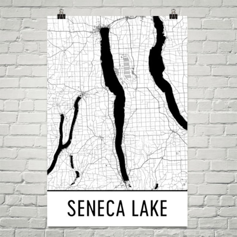 May include: Black and white map of Seneca Lake, New York. The lake is outlined in black and the surrounding area is filled with a grid pattern.