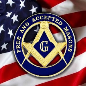 May include: A blue and gold Masonic emblem with the words "Free and Accepted Masons" around the edge. The emblem is set against a red, white, and blue American flag.
