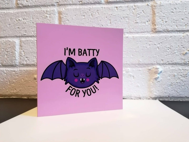 May include: A pink card with a purple bat illustration and the text "I'm Batty For You!"