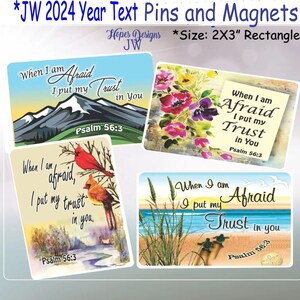 May include: Four different designs of 2x3 inch rectangular pins or magnets with the text "When I am Afraid I put my Trust in You" and "Psalm 56:3". The designs feature a mountain range, a floral arrangement, a pair of cardinals, and a beach scene.