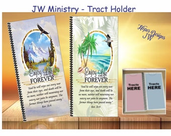 May include: Two spiral bound notebooks with a colorful nature scene on the front cover. The notebooks have the text "Enjoy Life Forever" and a Bible verse. The notebooks are on a wooden surface with two pink and blue notebooks that say "Tracts Here" on the front cover.