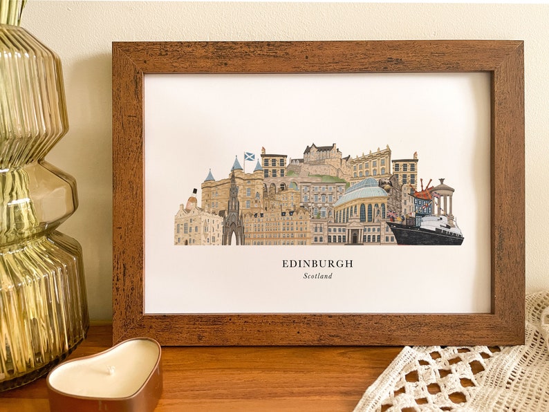 May include: A framed print of a colorful illustration of the Edinburgh skyline, featuring iconic landmarks like Edinburgh Castle and the Scottish Parliament. The print is titled "EDINBURGH, Scotland".