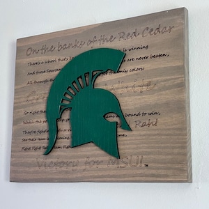 Canción de lucha de la Universidad Estatal de Michigan (MSU), colgante de pared con licencia oficial (8321) Regalo (1021012FS)