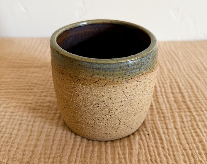 Speckled clay body hand thrown ceramic drinking vessel