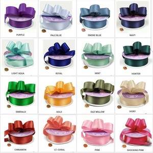 May include: A collection of 20 different colors of satin ribbon, each tied into a bow. The ribbon is 1.5 inches wide and is available in a variety of colors, including silver, purple, light aqua, emerald, cinnamon, wine, red, black, and white.