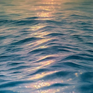 May include: An abstract painting of ocean waves with a golden sunset reflecting on the water. The water is a deep blue with highlights of gold and orange. The sky is a soft orange and gray.