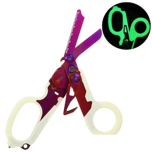 May include: Multi-tool medical shears with a vibrant color scheme. The shears feature a purple and red blade with a ruler, cream-colored handles, and a glowing green outline of the shears in a circle. The shears are designed for medical use.