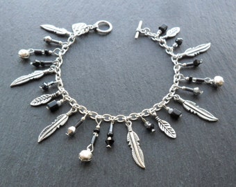 Verenbedelarmband: verzilverde ketting, zwarte kristalkralen