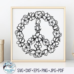 May include: Black and white peace sign surrounded by a wreath of flowers. The peace sign is a symbol of peace and love.