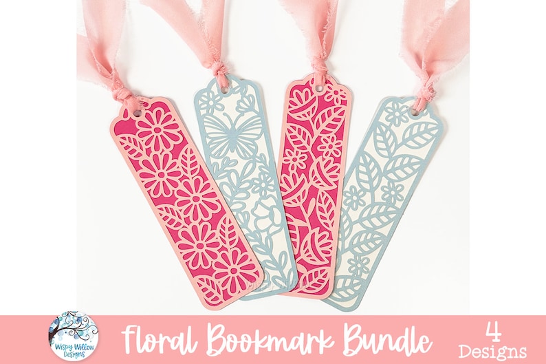 May include: Four rectangular bookmarks featuring intricate laser-cut designs of flowers, leaves, and a butterfly. Two bookmarks are bright pink and two are light blue. Each bookmark has a hole at the top with a tied light pink fabric ribbon.