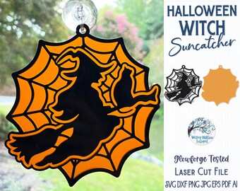 May include: A Halloween witch suncatcher featuring a black silhouette of a witch flying on a broomstick against an orange spiderweb background. The design includes a suction cup for hanging and text reading HALLOWEEN WITCH Suncatcher.
