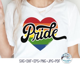 May include: A white short-sleeved t-shirt featuring a large heart graphic filled with horizontal rainbow stripes. The word Pride is written across the heart in a bold, black, cursive script font. The text SVG, DXF, EPS, PNG, JPG, PDF is visible.