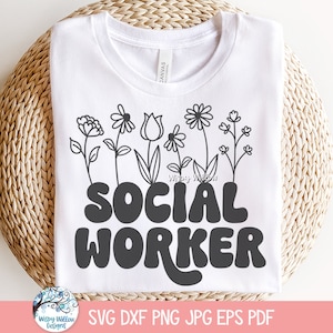 May include: White t-shirt with black text that reads "SOCIAL WORKER" in a retro font. The text is surrounded by a row of black and white flowers.