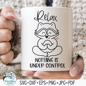 May include: White ceramic mug with a black and white illustration of a raccoon meditating with the text "Relax, Nothing is Under Control".