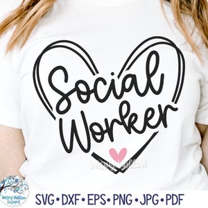 May include: A white t-shirt with a black heart design that says "Social Worker" inside the heart. There is a small pink heart in the centre of the heart design.