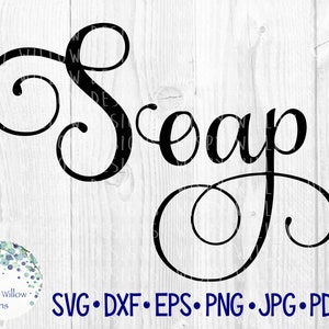 May include: Black cursive text that reads "Soap" on a white wooden background. The word is in a decorative font with swirling flourishes. Below the word are file type abbreviations: SVG, DXF, EPS, PNG, JPG, and PDF.