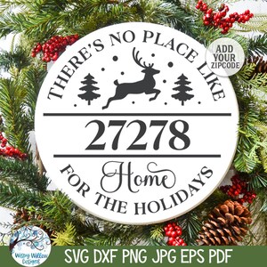 May include: A circular white sign featuring black text that reads THERE'S NO PLACE LIKE 27278 HOME FOR THE HOLIDAYS. The design includes a silhouette of a leaping reindeer, two pine trees, and small dots. A circular badge in the corner says ADD YOUR ZIPCODE.