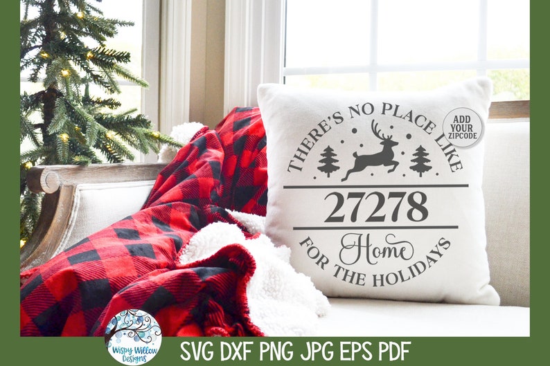 May include: A white square throw pillow featuring a dark gray graphic of a leaping reindeer, two pine trees, and the text "THERE'S NO PLACE LIKE 27278 HOME FOR THE HOLIDAYS" with a small circular badge that reads "ADD YOUR ZIPCODE".