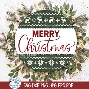 May include: A circular sign featuring a dark green background with white patterns of reindeer and snowflakes. The center has a white horizontal band with the text Merry Christmas in dark red script and block lettering. The design is festive.