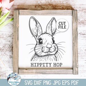 Może przedstawiać: Czarno-biała liniowa ilustracja twarzy królika z tekstem "Hippity Hop" poniżej. Obraz znajduje się na białym tle z drewnianą ramą.