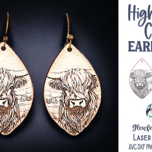 May include: A pair of teardrop-shaped wooden earrings featuring a laser-engraved Highland cow illustration. The earrings hang from bronze-toned metal hooks. The image includes text reading Highland Cow Earrings, Glowforge Tested Laser Cut File.
