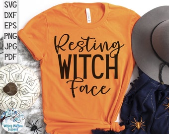 May include: Orange t-shirt with the text "Resting Witch Face" in black lettering.