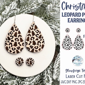May include: A pair of wooden Christmas tree and leopard print dangle earrings and a pair of matching stud earrings. The earrings are laser cut and ready to be made into a craft project.