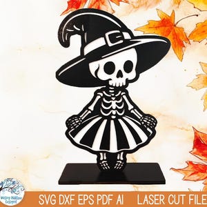 May include: Black and white Halloween skeleton sign wearing a witch hat and dress. The sign is on a black base with the words "HALLOWEEN SKELETON SIGN" on the left side. The bottom of the sign reads "SVG DXF EPS PDF AI LASER CUT FILE".
