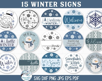 May include: A collection of 15 circular winter-themed signs featuring blue and white color palettes. Designs include snowmen, snowflakes, cable knit patterns, and text such as Hello Winter, Welcome, Let It Snow, and Dashing through the snow.