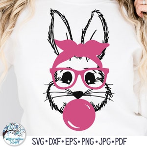 May include: White sweatshirt featuring a graphic of a bunny face with a pink bow, glasses, and bubble gum. The design includes SVG, DXF, EPS, PNG, JPG, and PDF file formats. The Wispy Willow Designs logo is in the lower left corner.