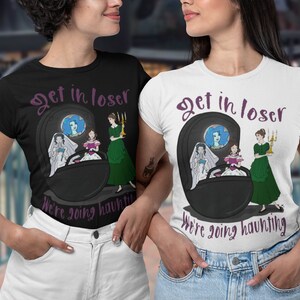 May include: Black and white t-shirts with the text "Get in loser, We're going haunting." The shirts feature a cartoon graphic of a haunted carriage with three women. One shirt is black, the other is white.