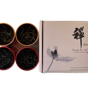 May include: A set of four small, round, red and gold metal canisters filled with loose leaf tea. The canisters are arranged in a square shape. The canisters are in front of a box with a light brown background. The box has a black and white illustration of a small person sitting on a flower. The box has the text "Zen" and "Yunnan Pu-erh Tea" printed on it.