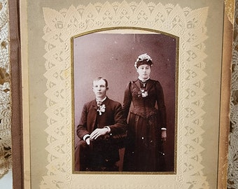 Original antique double sided page from 1800s photo album with 2 original photos. Wedding and baby.