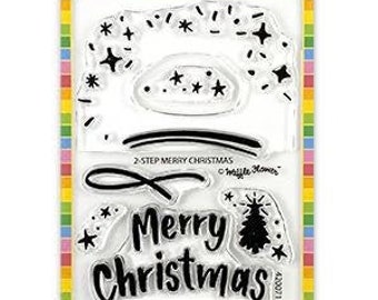 May include: Clear stamp set with a two-step design featuring the words "Merry Christmas" and a Christmas tree with stars. The stamp set is made in the USA.