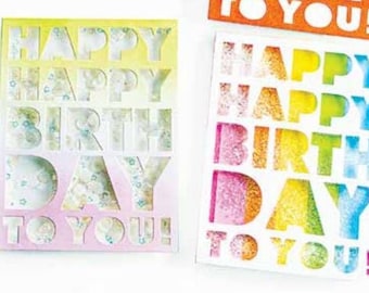 May include: Two birthday cards with the words "Happy Happy Birthday Day To You!" in white letters on a colorful background. The letters are cut out and the background is visible through the letters.