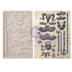May include: Silicone mold with a variety of gothic-themed designs, including wings, skulls, chains, and cat heads. The mold is shown next to a printed sheet with the same designs.