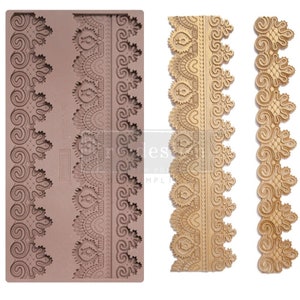 May include: A silicone mold for baking with three different lace designs. The mold is brown and the designs are in a gold color.