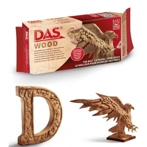 May include: A box of DAS Wood air-hardening modeling clay. The box is red and brown with a picture of a wooden eagle sculpture. The text on the box reads "DAS Wood Pasta legno per modellare. Essicca all'aria Wood modelling clay. Air-hardening. Pâte à modeler aspect bois. Séche à l'air. Pasca de maders para modelan. Seca al aire. Pusta de madeira para modelar. Seca ao ar. Modelliermasse in Holzoptik. Lufttrocknend.  THE BEST TO MODEL YOUR IDEAS LE MEILLEUR POUR MODELER VOS IDEES MADE IN ITALY SINCE 1943 FABRIQUE EN ITALIE DEPUIS 1943"