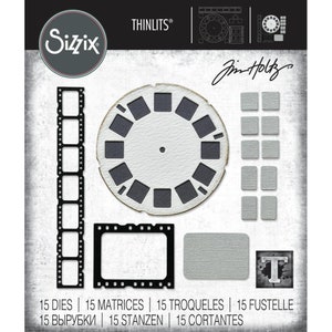 May include: A Sizzix Thinlits die set with a retro film reel design, frames, and textured squares. The set includes 15 dies, with the text "15 DIES | 15 MATRICES | 15 TROQUELES | 15 FUSTELLE | 15 ВЫРУБКИ | 15 STANZEN | 15 CORTANTES".