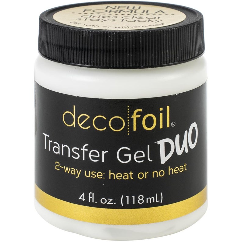 May include: A white jar with a black label that says "deco foil Transfer Gel Duo 2-way use: heat or no heat 4 fl. oz. (118mL)"