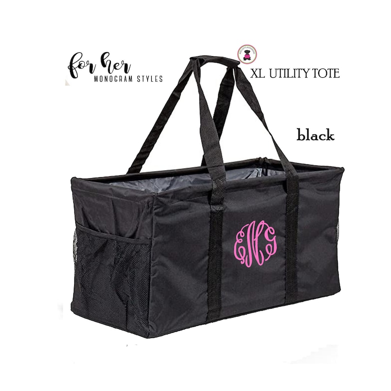 May include: Black XL utility tote bag with a pink monogram "E.F.G." and the text "XL UTILITY TOTE" and "black".