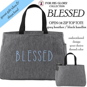 May include: Gray tote bag with black handles and the word "BLESSED" embroidered in light blue thread. The tote bag is made of a soft, textured fabric. The bag is available in an open top or zip top style.