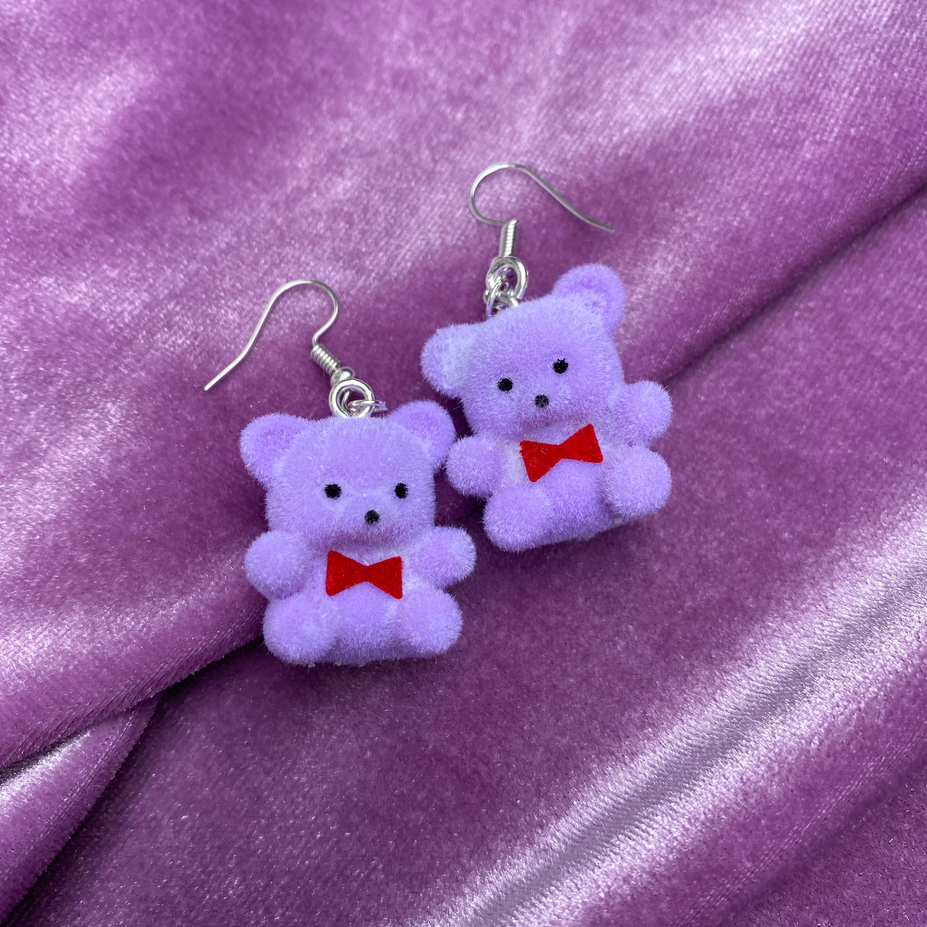 teddy bear with purple bow tie