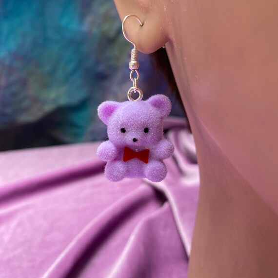 teddy bear with purple bow tie