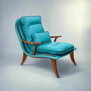 May include: A teal blue chaise longue with wooden legs and a matching teal blue cushion. The chaise longue has a curved back and a wide seat.