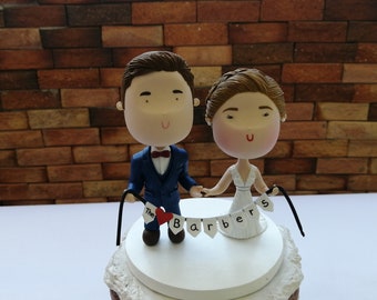 Couple holding hands with banner Bride And Groom Couple Figurine Wedding Cake Topper