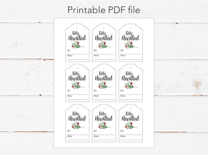 May include: Nine printable gift tags with a white background and black text that reads "Feliz Navidad". Each tag features a green sprig with red berries.