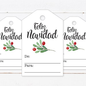 May include: Three white gift tags with a green sprig and red berries. The tags have the text "Feliz Navidad" written in black cursive. Each tag has a space for "De:" and "Para:" to write the giver and receiver's names.
