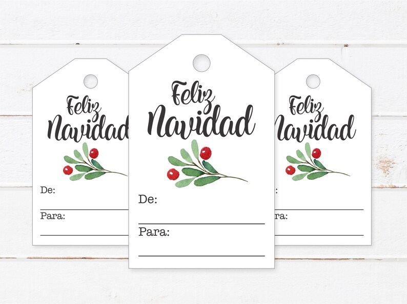 May include: Three white gift tags with a green sprig and red berries. The tags have the text "Feliz Navidad" written in black cursive. Each tag has a space for "De:" and "Para:" to write the giver and receiver's names.