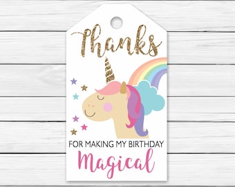 May include: White thank you tag with a gold glitter "Thanks" and a cartoon unicorn with a rainbow and stars. The text below the unicorn says "For making my birthday magical".